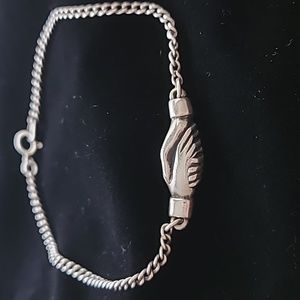 Rare vintage James Avery holding hands bracelet